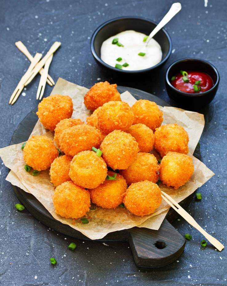 Step-by-step guide on how cheeseballs are made with ingredients and finished product.