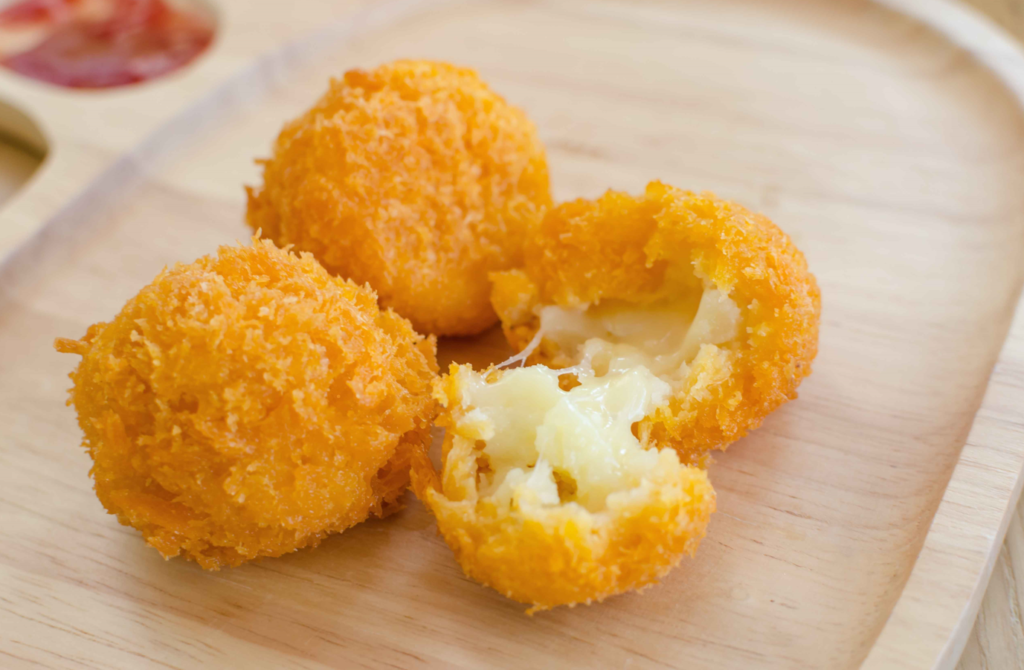 Step-by-step guide on how cheeseballs are made with ingredients and finished product.