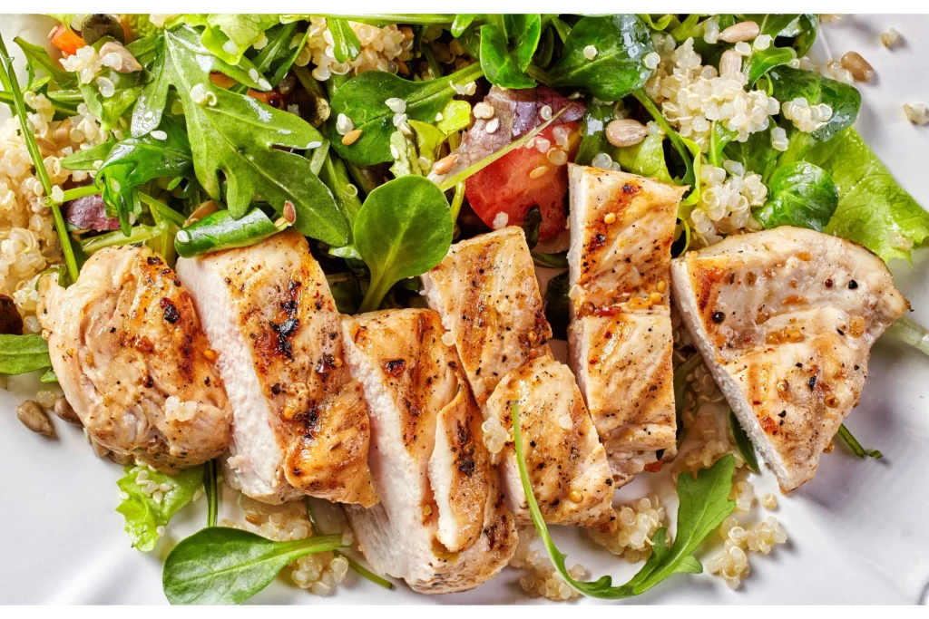 A delicious chicken salad with both hot and cold chicken options displayed in a vibrant dish.