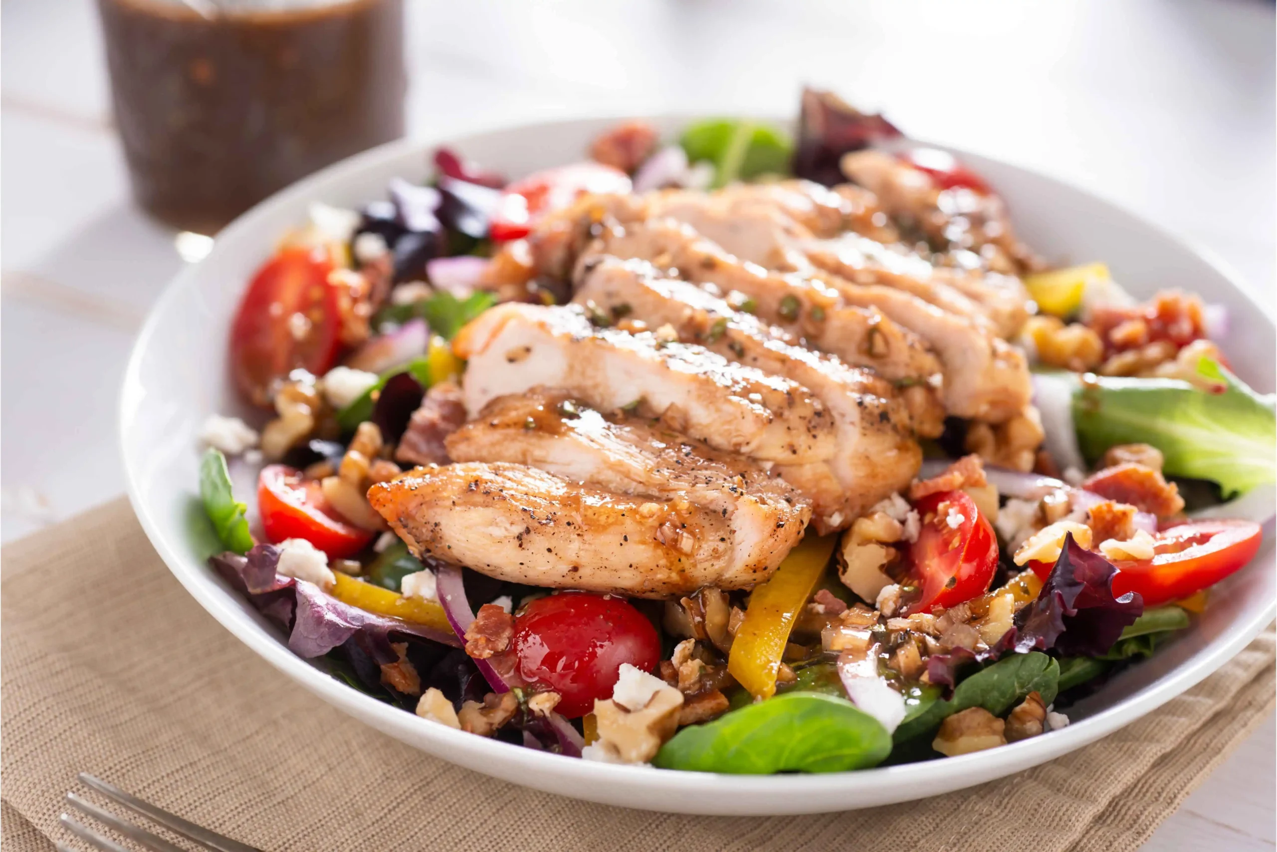 A delicious chicken salad with both hot and cold chicken options displayed in a vibrant dish.