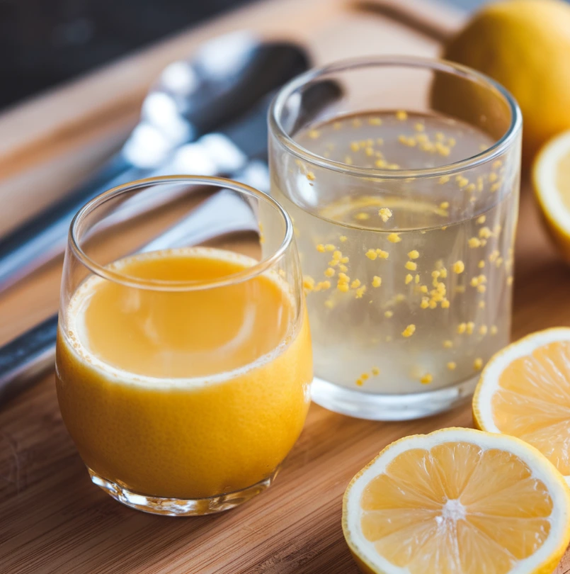 A comparison of fresh and spoiled lemon juice on a cutting board