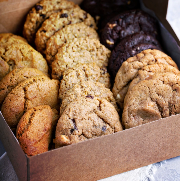 A close-up of soft, freshly baked Nestle cookies on a cooling rack.