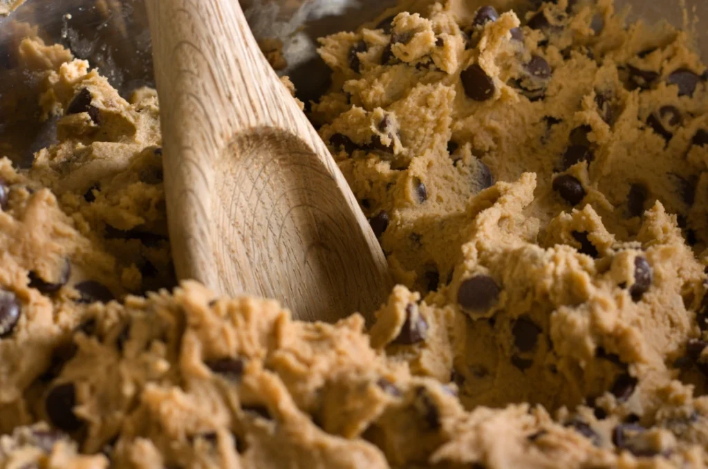 Freshly baked Nestle chocolate chip cookies on a cooling rack